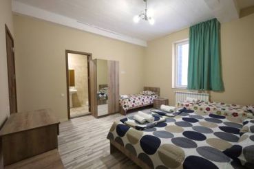 Quadruple Room with Private Bathroom